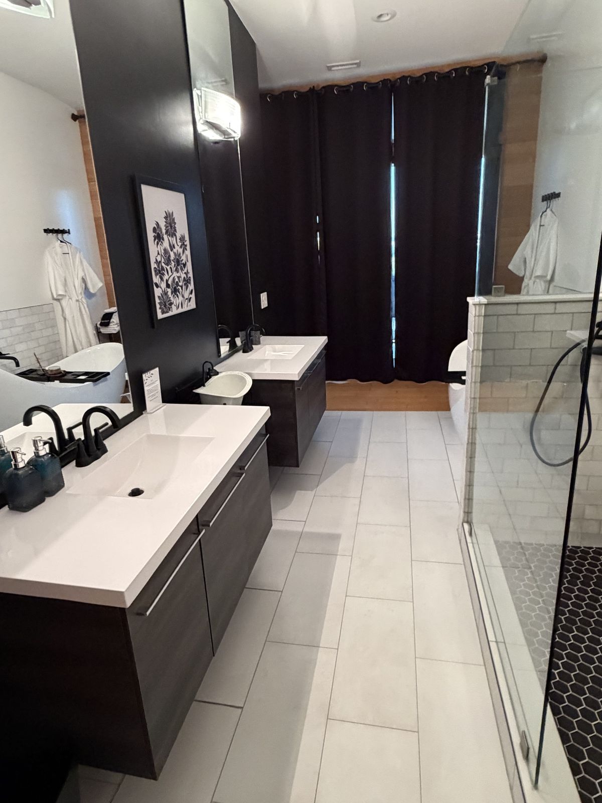 The same bathroom: sanitized, restocked and staged with fresh robes