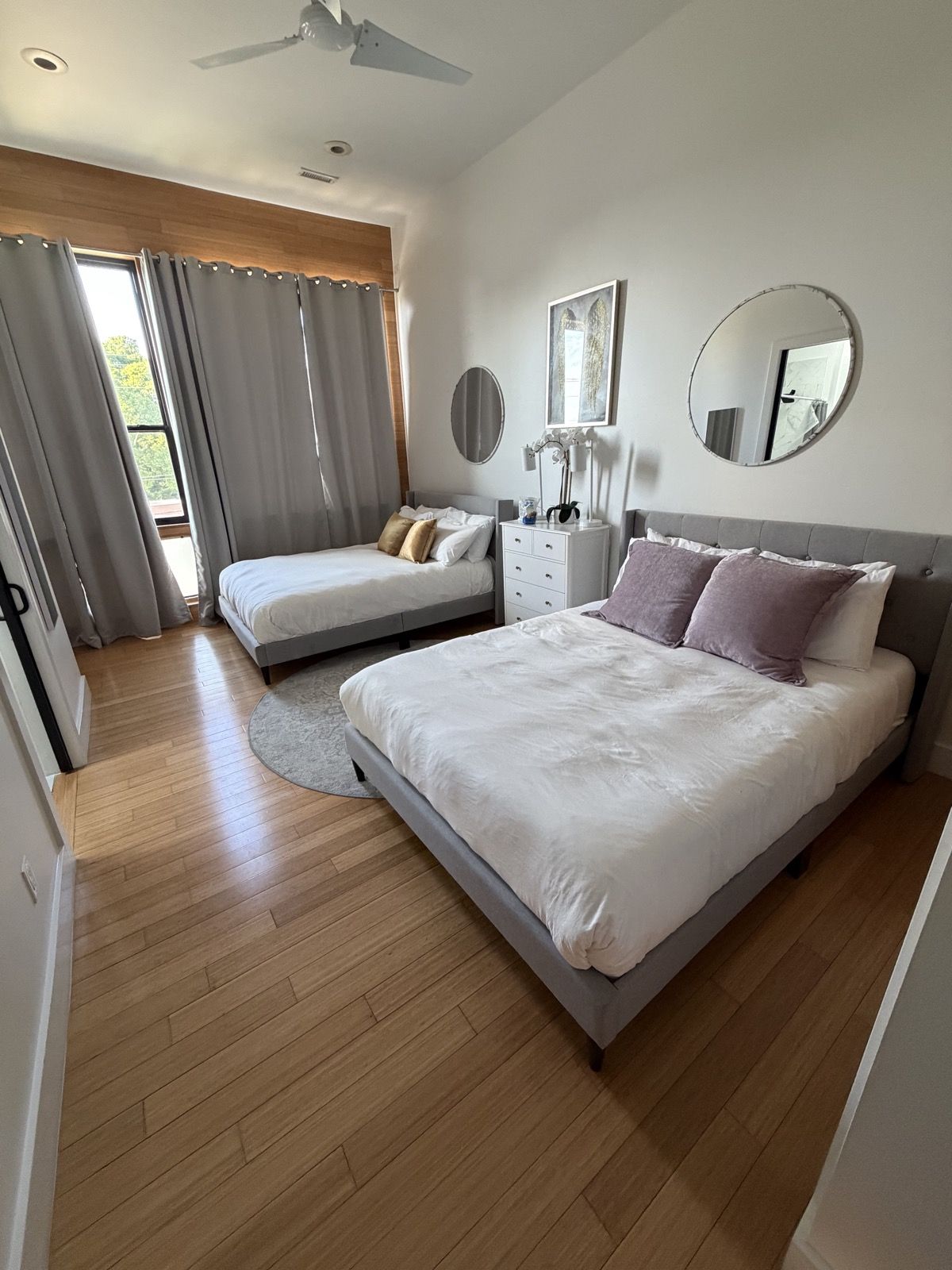 Same room, same angle: both beds made and reset to match the listing