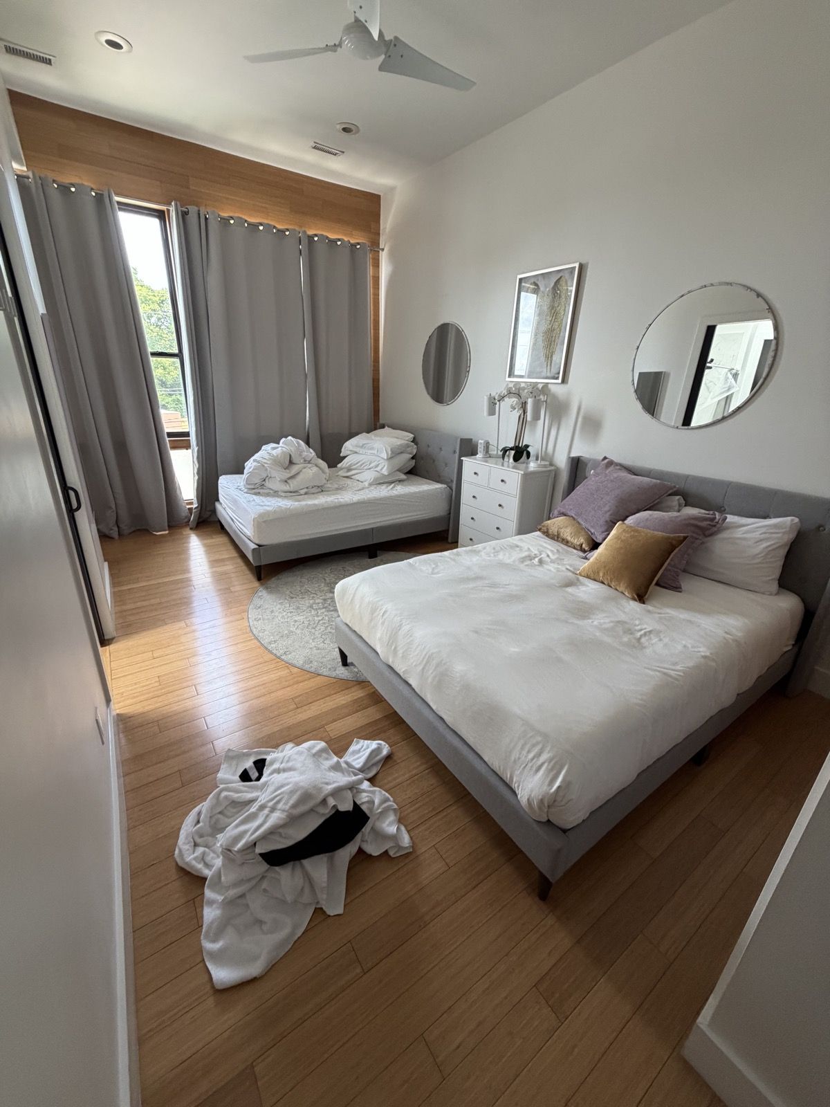 Guest room after checkout: used linens and towels on the floor