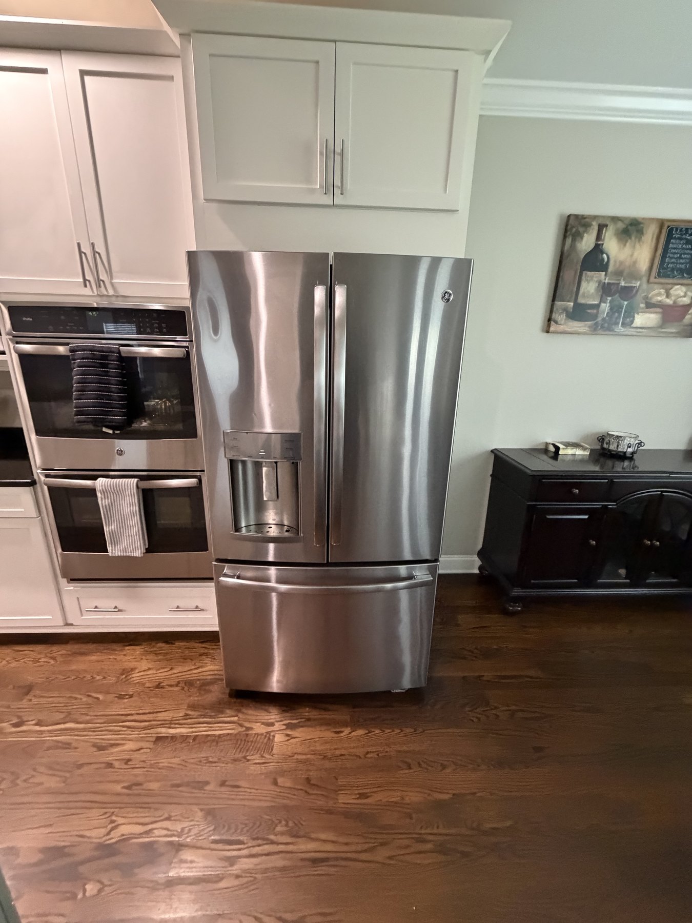 Clean kitchen appliance area before move-in